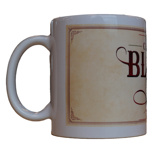 white coffee mug features the Clint Black logo with a Christmas design