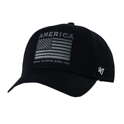 black hat features a gray American flag graphic on the front with text that reads "America Still In Love With You." The back features a Clint Black logo.